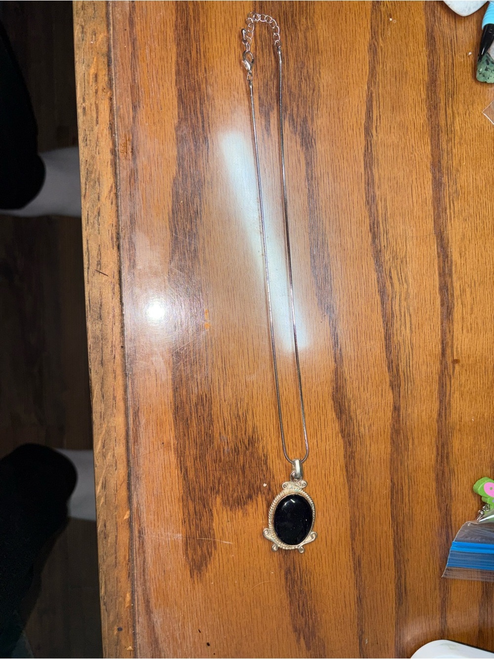 Silver tone blue gold stone necklace. 11 inches